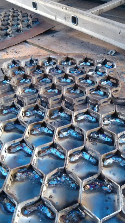Rows of hexmesh panels welded in place before lining